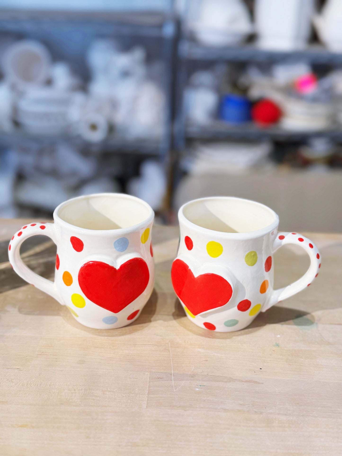 Bright polka dot love heart mugs