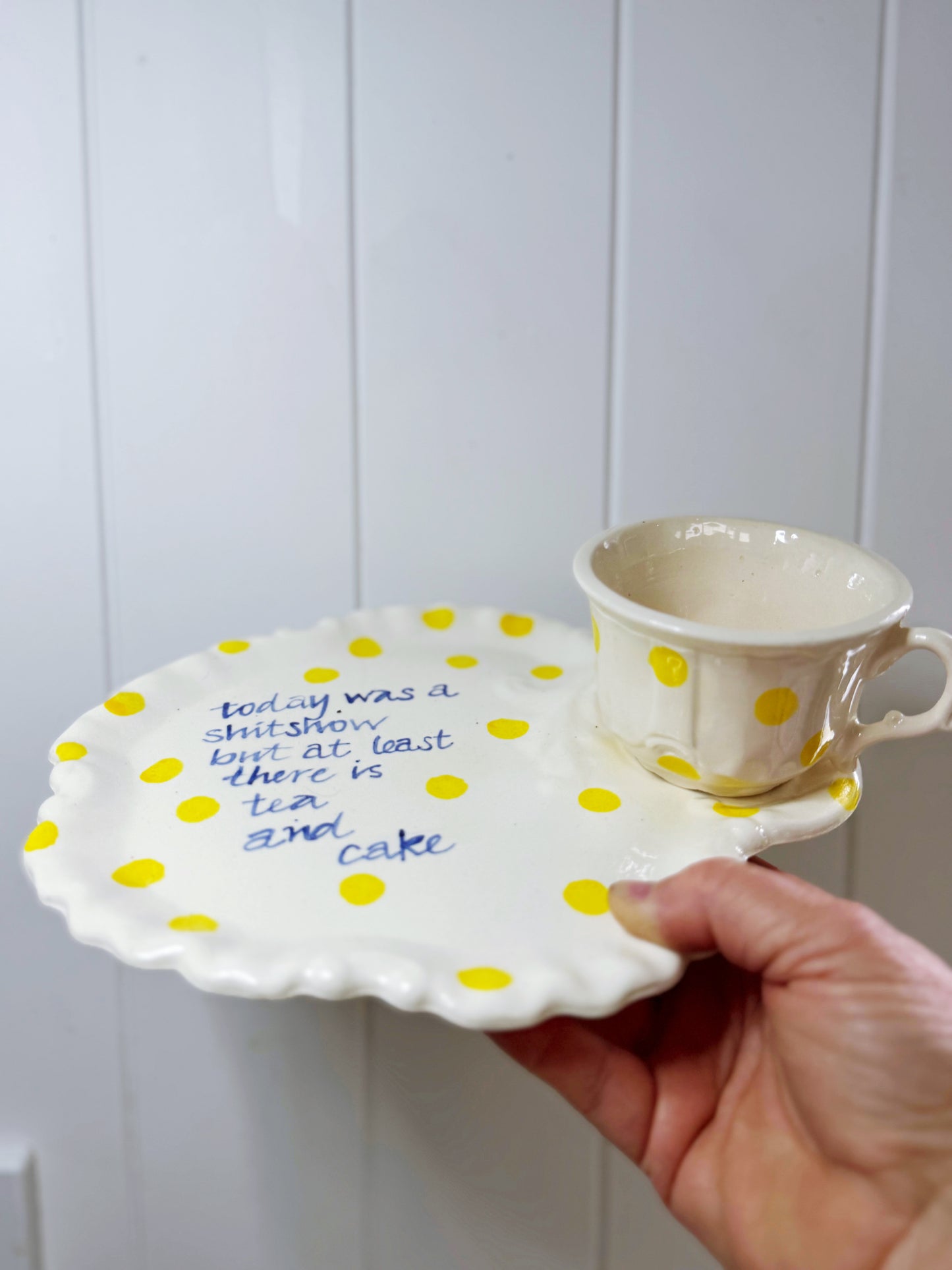‘At least there is Tea + cake’ teacup and cake plate tennis set.